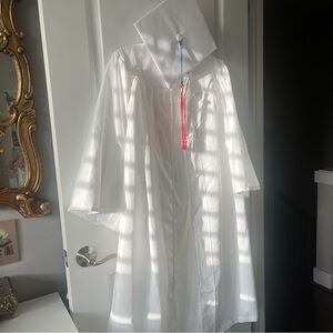 White graduation cap and gown